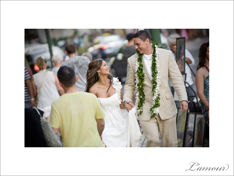 Bride and Groom walking down Waikiki in Hawaii to their Reception 
