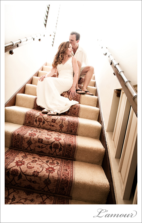 Hawaii destination wedding Bride and Groom sit posed on a staircase
