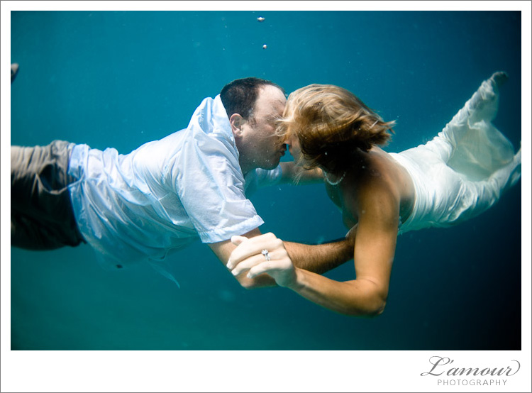 Trash the Dress photos taken underwater in Hawaii by L'Amour Photography