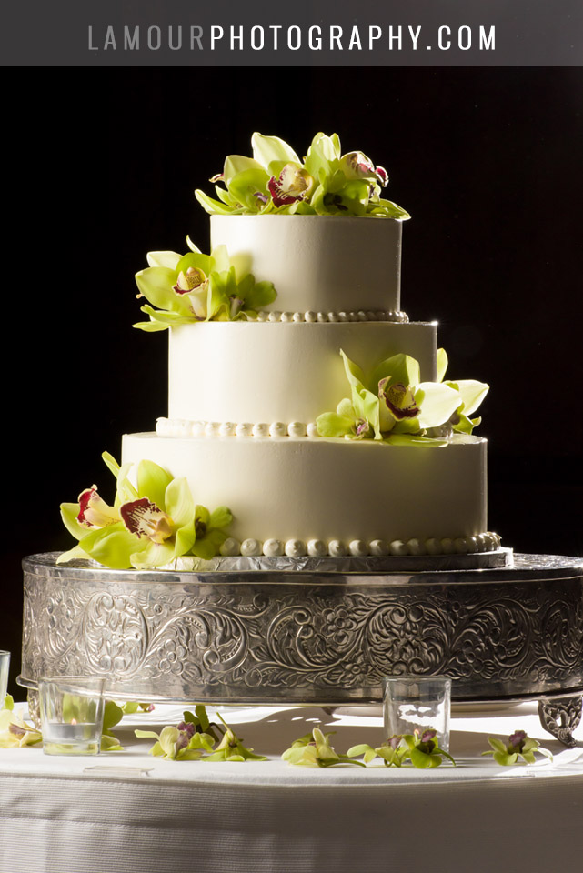 Hawaii wedding cake white buttercream round three tier with green orchids