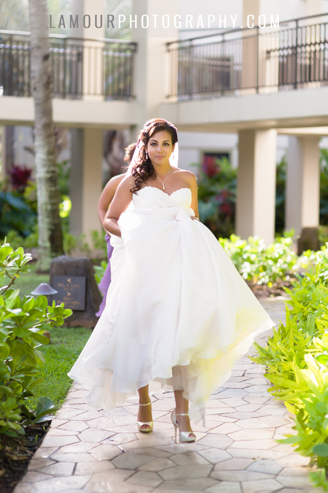 Bride walking down aisle at turtle Bay resort wedding on Oahu with photography and video by L'Amour