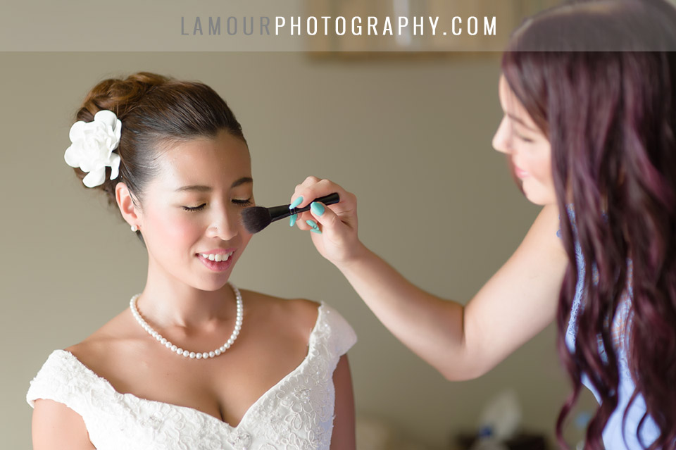 Bride gets hair and makeup done at Turtle Bay Resort for her Hawaii Wedding