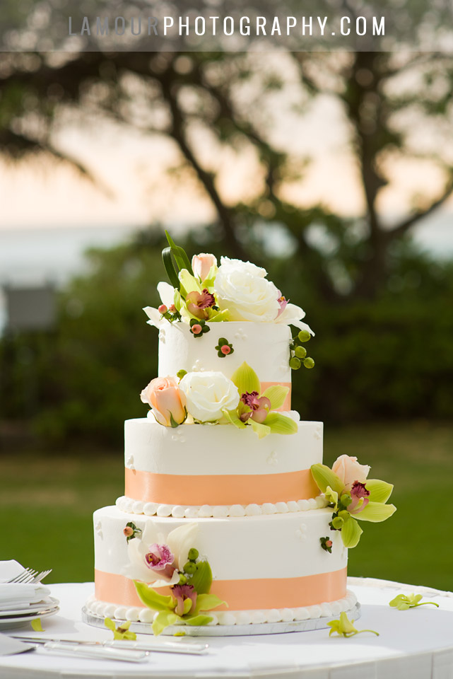 3 tier round buttercream wedding cake with orange ribbon
