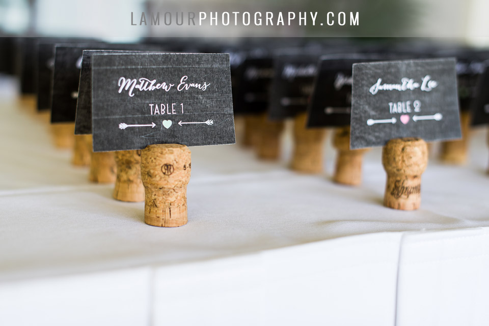 cute place cards settings with hearts arrows and wine cork