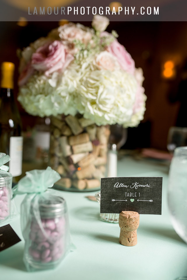 pastel green and pink wedding theme with wine cork place card