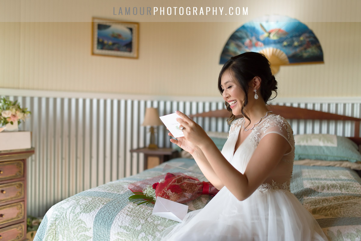 Happy bride opens card before maui wedding ceremony photo and video