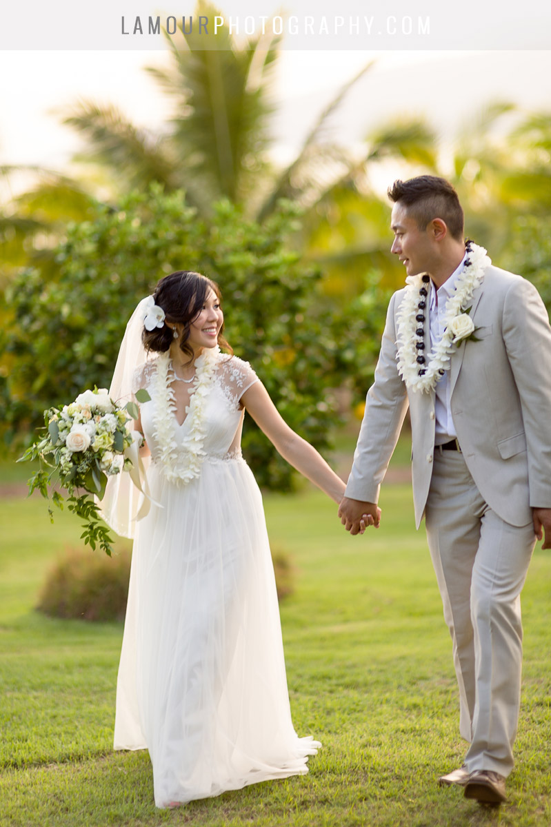 Hawaii bride and groom walk in destination wedding in maui