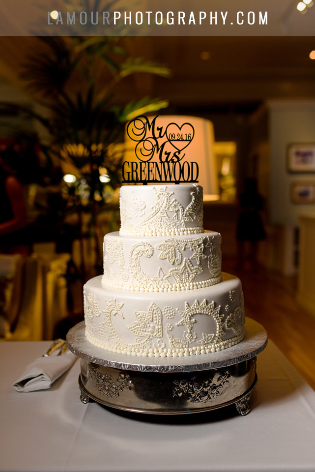 white wedding cake with lace decorations