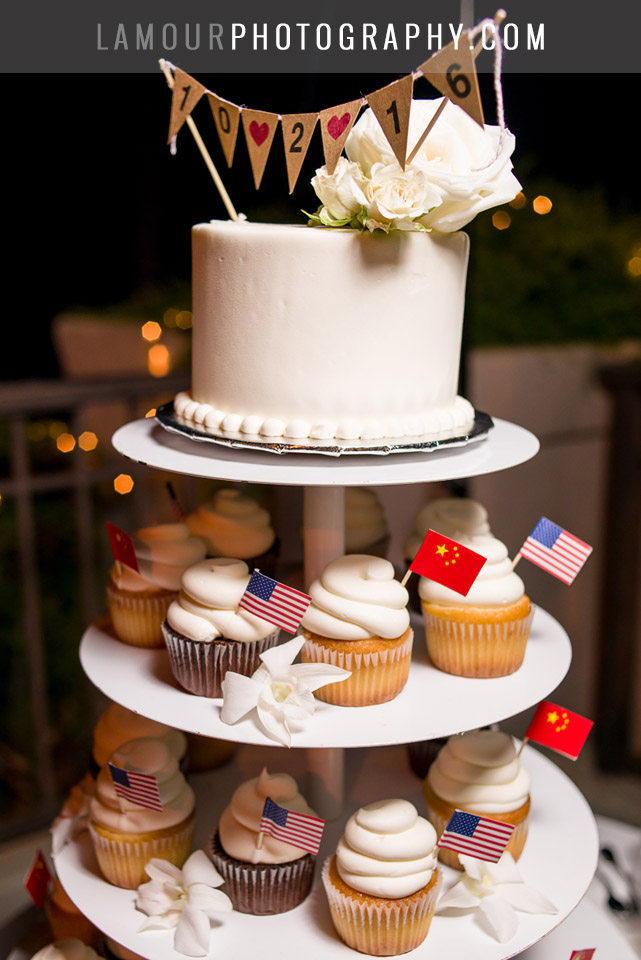 hawaii wedding cake with cupcakes and pendant sign on top