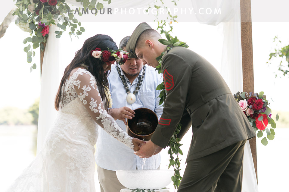 Bride and groom during Hawaii wedding ceremony at Kualoa Ranch