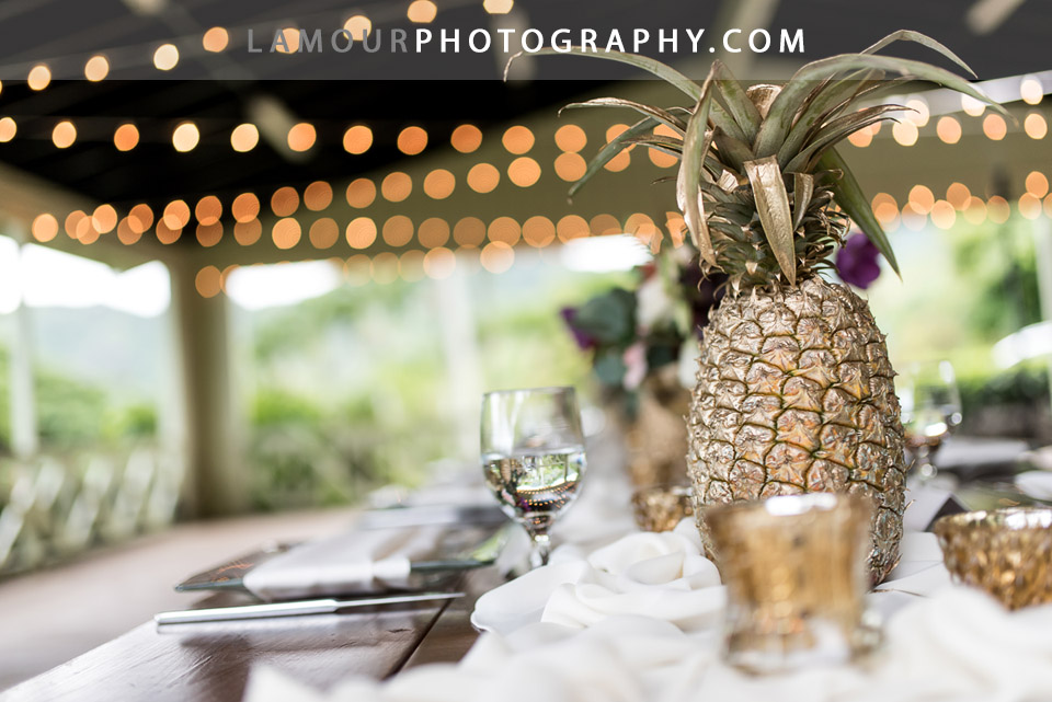 Gold Pineapples were centerpieces for Hawaii wedding reception at Kualoa Ranch
